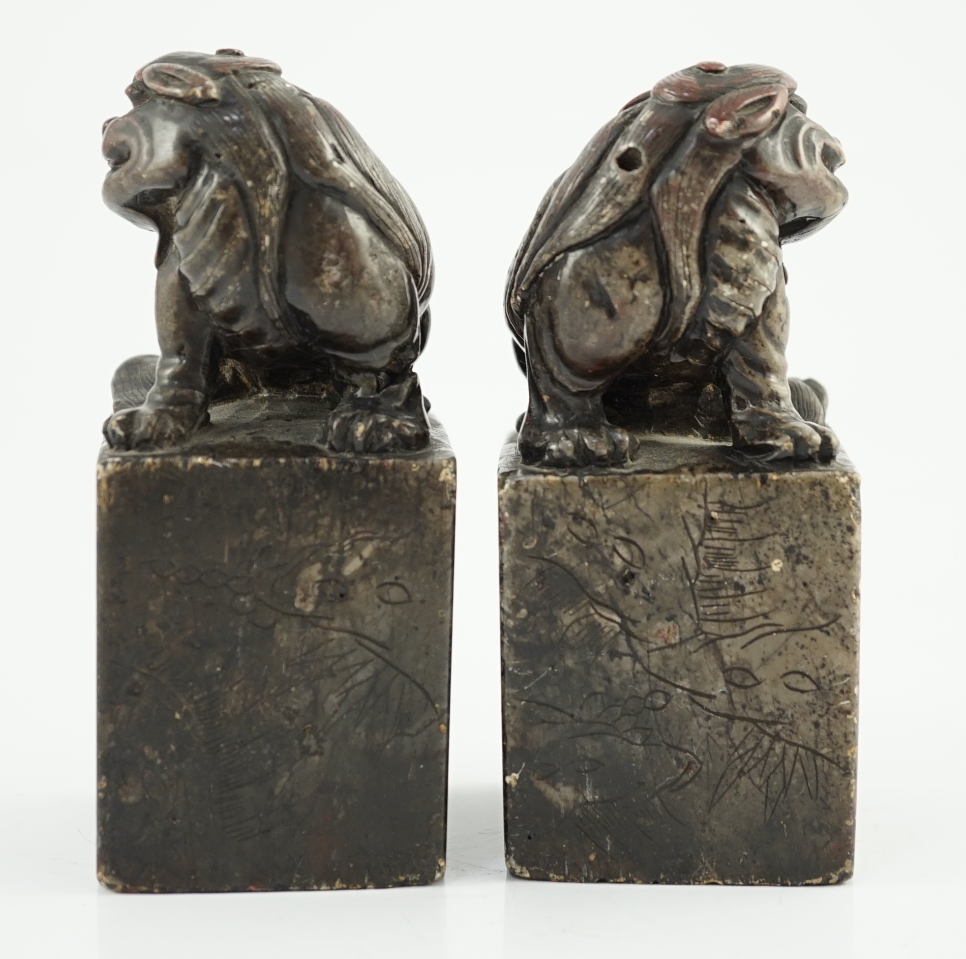 A pair of Chinese soapstone lion-dog seals, Qing dynasty